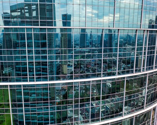 A modern skyscraper glass building in Jakarta central business district